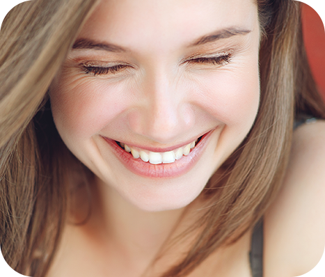 closeup of a smiling brunette woman